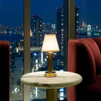 Wren Fabric Table Lamp – lit on a marble table at night