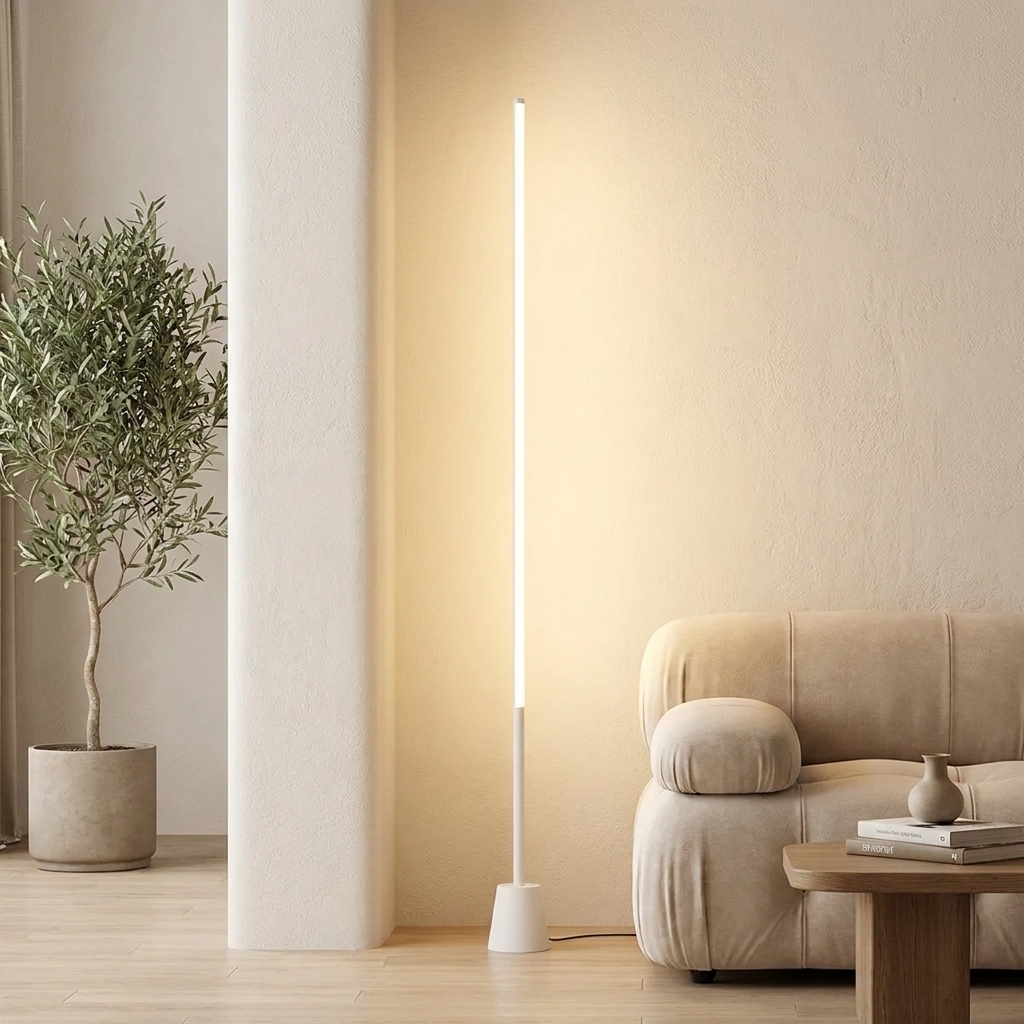 Slimline 360 LED Floor Lamp – lit beside a sofa and potted olive tree