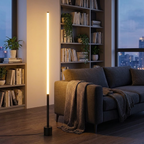 Slimline 360 LED Floor Lamp – lit beside a bookshelf at night