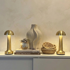 Alva Cordless Table Lamp – brass finish pair flanking a stoneware vase