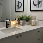 Ebba Table Lamp – on a bathroom vanity beside a plant