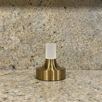 Ebba Table Lamp – close-up on a granite counter, brass finish