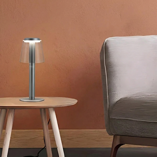 Fen Mushroom Touch Lamp – on a side table against a terracotta wall