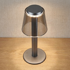 Fen Mushroom Touch Lamp – lit close-up against a beige woven wall