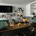 Halden Cordless Table Lamp – lit on a console table below a TV