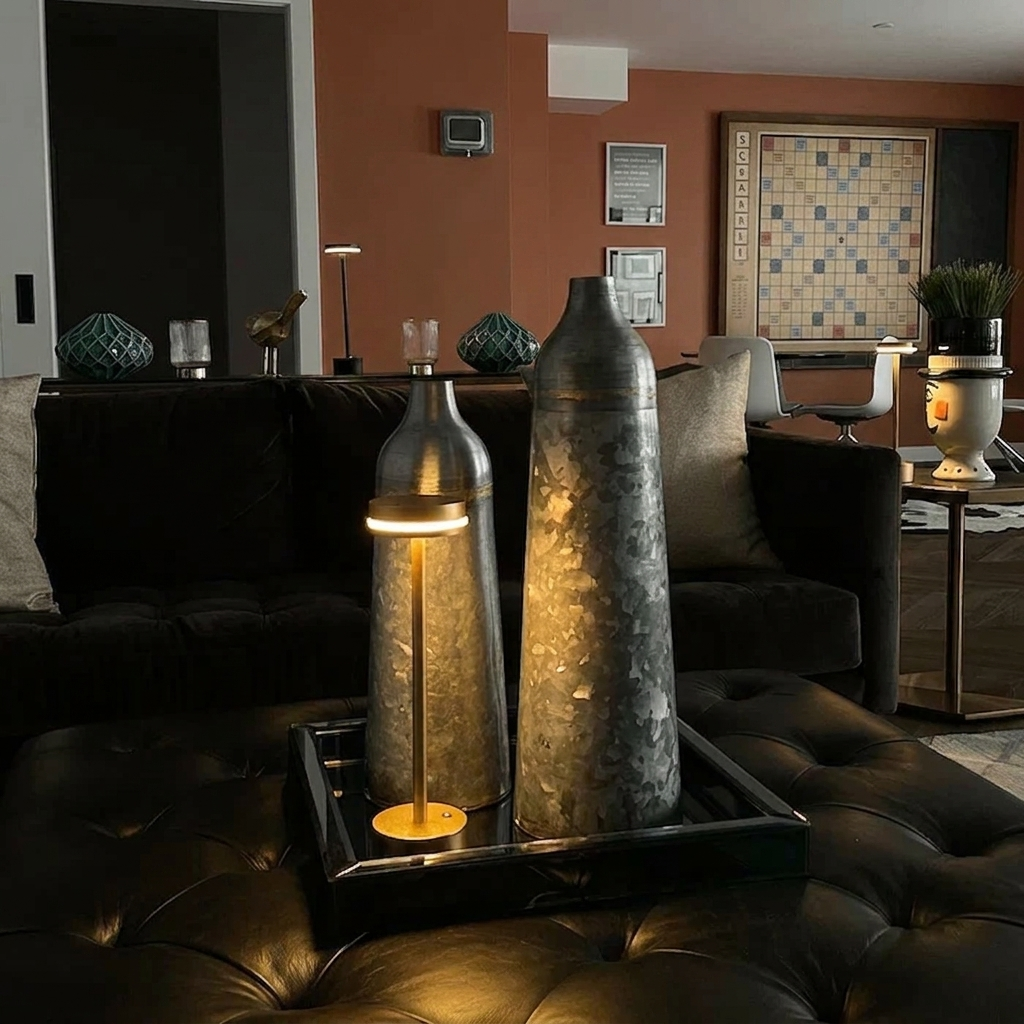 Halden Cordless Table Lamp – lit on an ottoman tray beside a vase