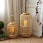 Reed Bamboo Candle Lantern – two sizes styled beside a curtain and berries