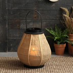 Hollis Wooden Candle Lantern – lit lantern on a dark wood background