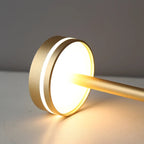 Halden Cordless Table Lamp – close-up of the lit lamp head, gold finish