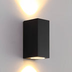 Square Outdoor Up & Down Wall Light – lit up and down on a plain wall