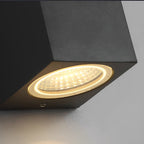 Square Outdoor Up & Down Wall Light – close-up of the lit lens, white background