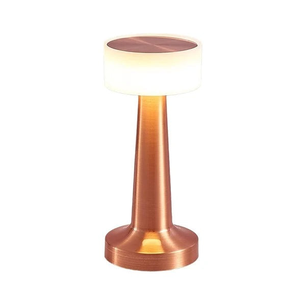 Pia Cordless Table Lamp – copper finish lit, white background