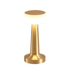 Pia Cordless Table Lamp – gold finish lit, white background