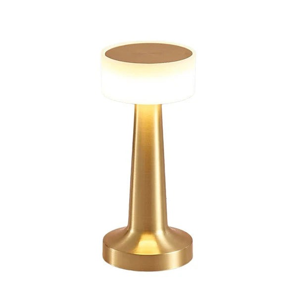 Pia Cordless Table Lamp – gold finish lit, white background